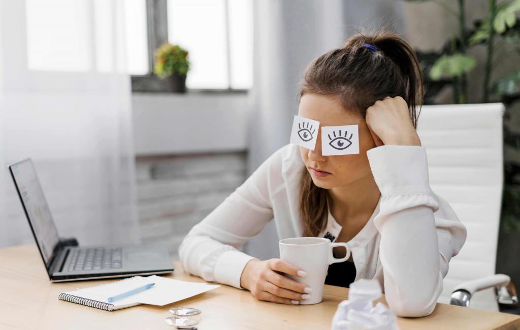 businesswoman-covering-her-eyes-with-drawn-eyes-paper (1).jpg